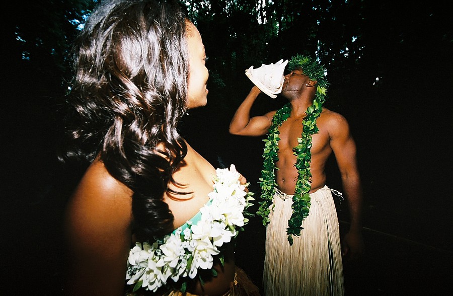blowing the conch shell for his lover in the forest of Oahu