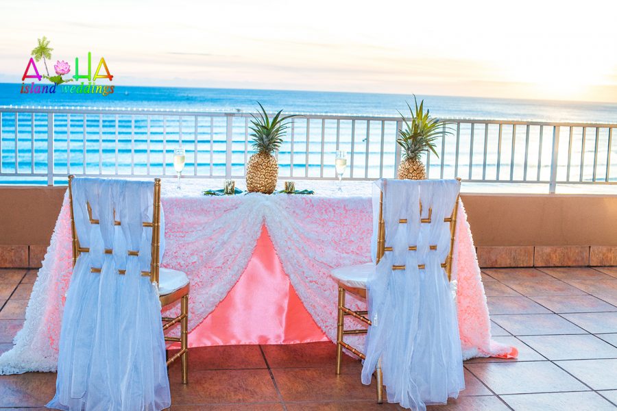 The bride and grooms chair over looking the ocean at Tiki Coconut club for the reception of Adrienne and Cedric for their 5 year wedding vow renewal