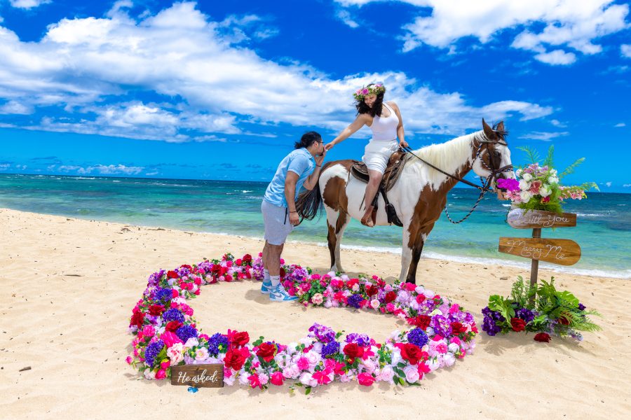 a kiss of love by the beach in Hawaii
