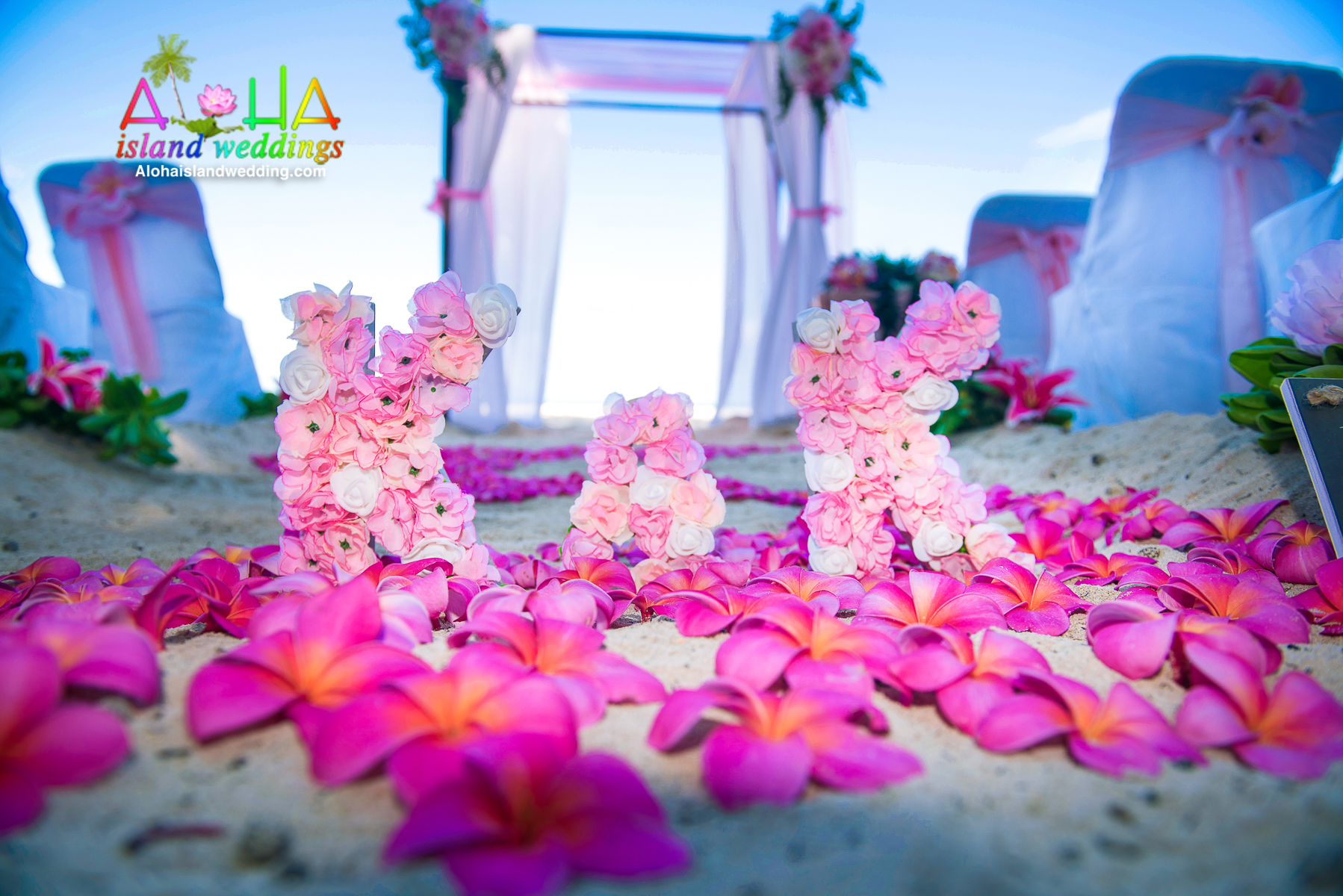 close up of the dark pink plumeria flowers for this ceremony at Waimanalo beach