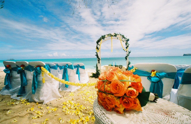orange rose bouquet with beach wedding yellow flowers