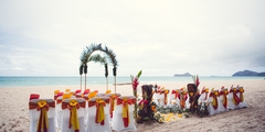 close up of a Hawaiian tiki for a beach wedding with Melanie