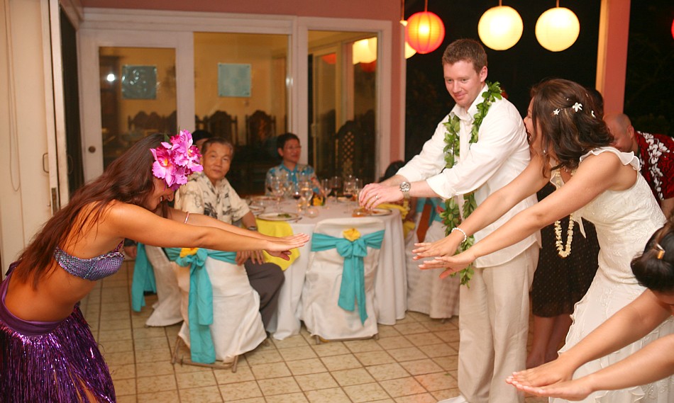 Kavena teaching the hula to the bride and groom at the dinner wedding reception on Oahu