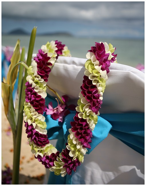 known as a Christina flower leis all orchid flowers or purple white and light green