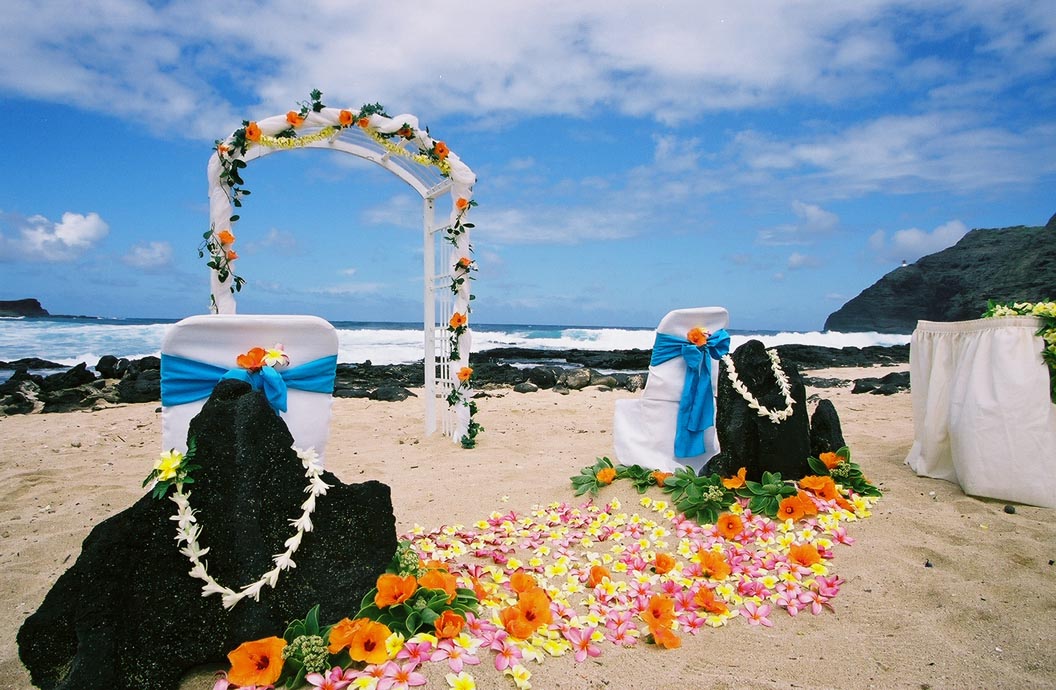 wedding of Hawaii lava rock with white tuberoase lei around them