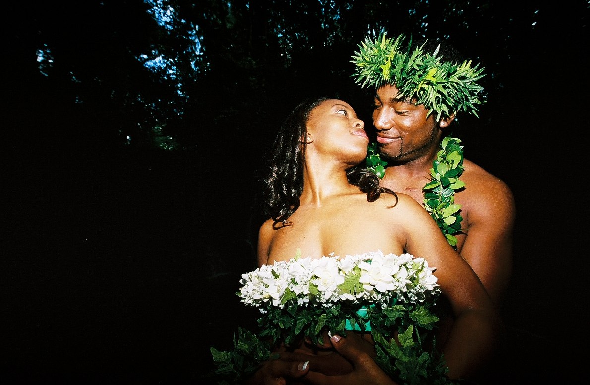 lovers in the forest after thier wedding photo shoot