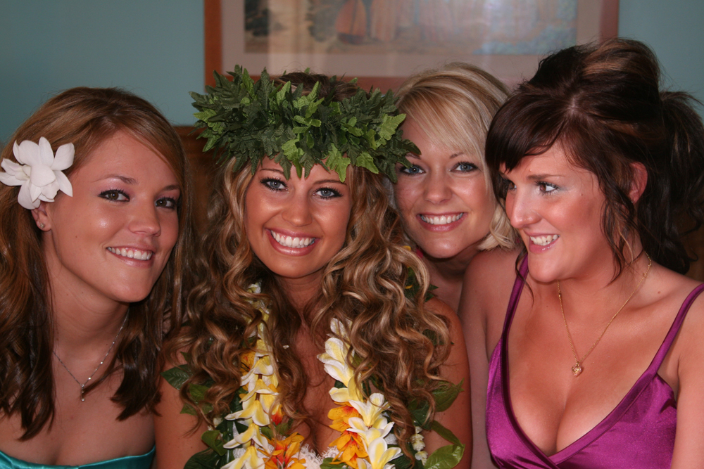 The bride wearing a Hawaiian head lei before her beach wedding in Hawaii