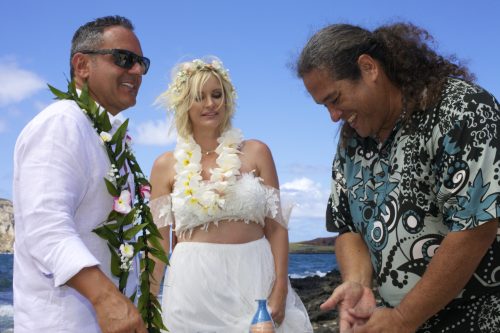 This 10 year vow renewal at Makapuu . beach the Hawaiian minister gives his blessings and love to the couple