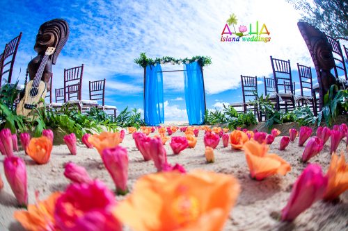 color theme sky lue with orange and pink flowers for the walkway aisle way on the sand
