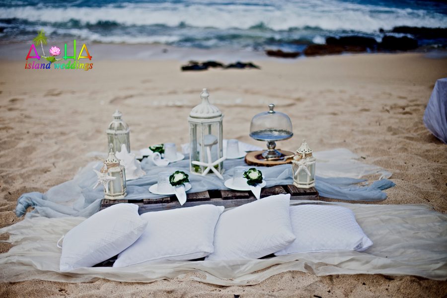 wedding vow renewal picnic at makapuu beach in Hawaii on Oahu with white pillows