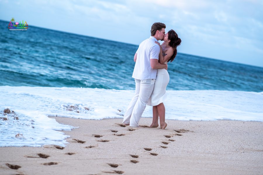 kissing during sunset by the waves