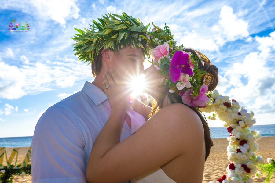 sun shin through the kiss at the proposal in Hawaii